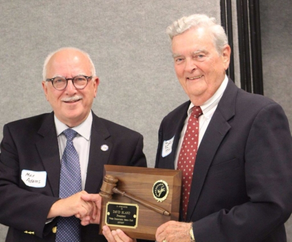 Incoming President Max Adams presents plaque to Outgoing President David Bland